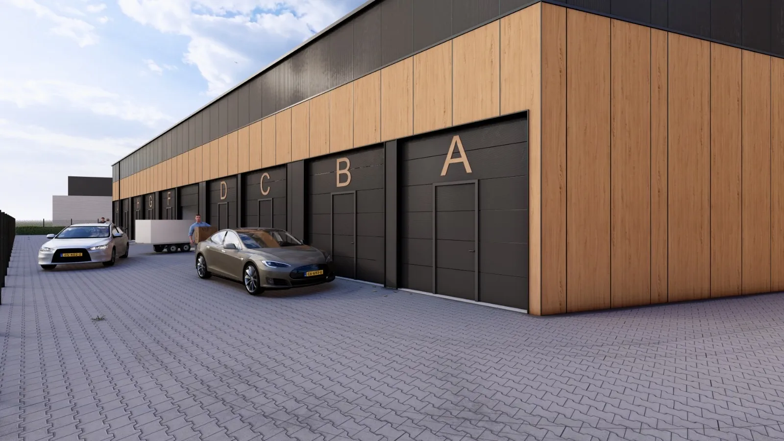 Hoek van een gebouw met de overheaddeuren van units A tot en met D